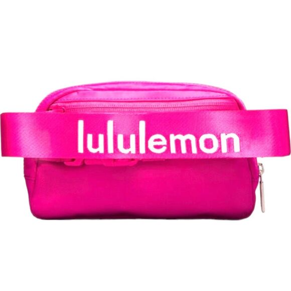 lululemon athletica Handbags - NEW LULULEMON Sonic Pink White Strap Logo Everywhere Belt Bag Hands Free Solutio